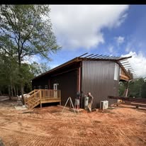 Metal-sided outbuilding with porch
